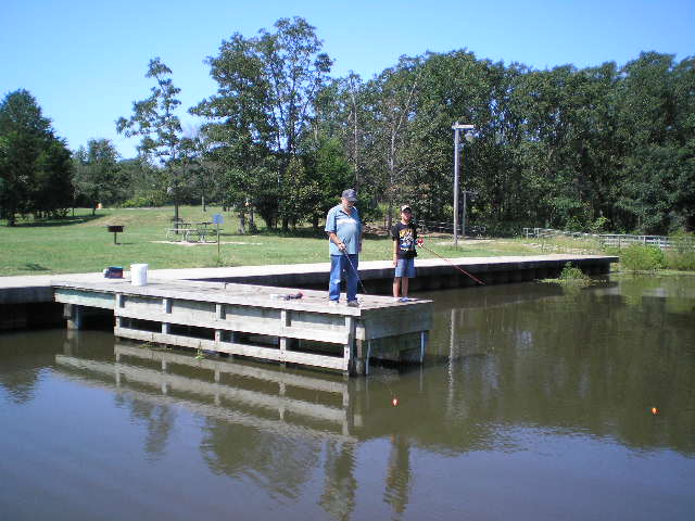 People fish at dock in S. Sulphur Park